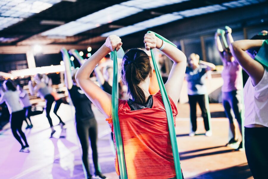 Woman using bands in an exercise class